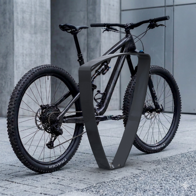 Bicicleta estacionada en aparcabicis peek