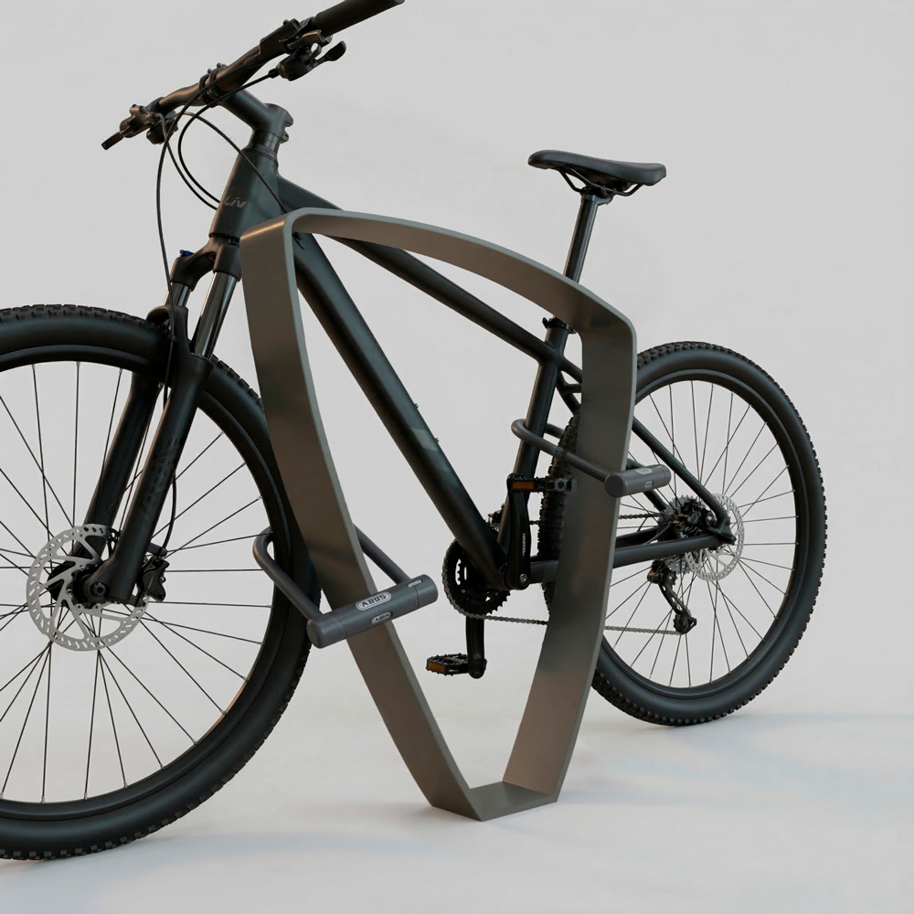 Bicicletas sujeta por dos puntos a aparcabicicletas peek